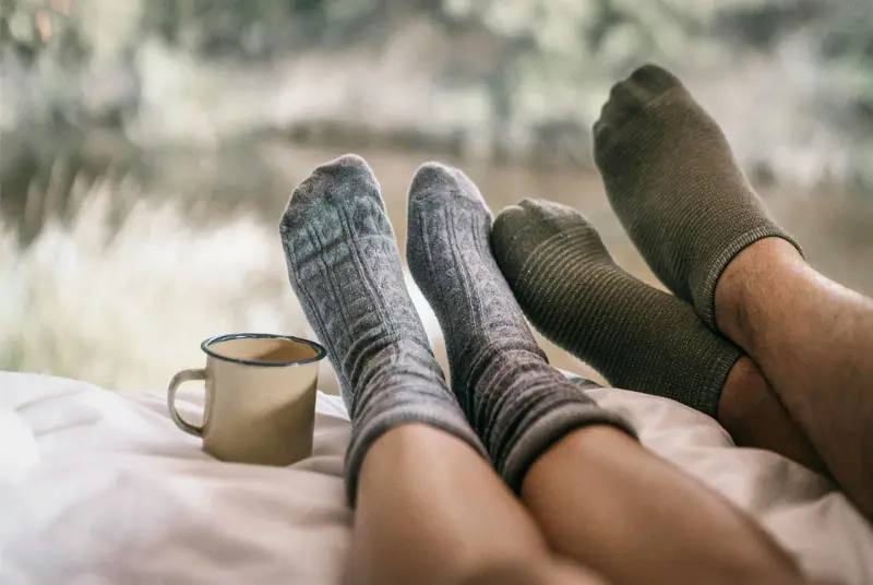 why do my feet colder with socks on
