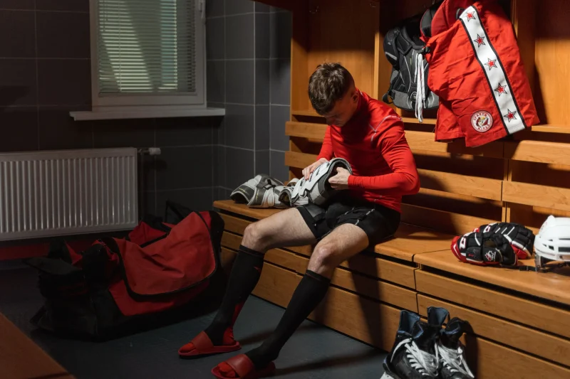 Athlete putting on compression socks before exercise