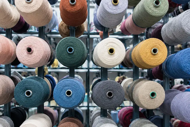 Colorful yarn cones used for wool and alpaca sock manufacturing